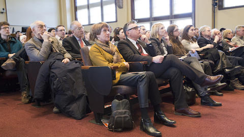 audience listening to speaker